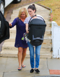 Rachel Bilson carries daughter Briar Rose to the car after a birthday party