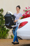 Rachel Bilson carries daughter Briar Rose to the car after a birthday party