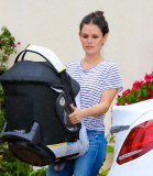 Rachel Bilson carries daughter Briar Rose to the car after a birthday party