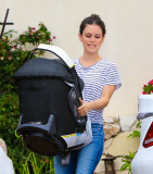 Rachel Bilson carries daughter Briar Rose to the car after a birthday party