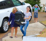 Rachel Bilson carries daughter Briar Rose to the car after a birthday party