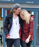 EXC: ELLIE GOULDING ARRIVES AT HEATHROW AIRPORT