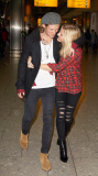 EXC: ELLIE GOULDING ARRIVES AT HEATHROW AIRPORT
