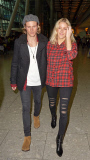 EXC: ELLIE GOULDING ARRIVES AT HEATHROW AIRPORT