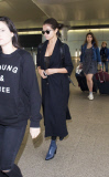 FAMEFLYNET - Selena Gomez Seen Arriving At Heathrow Airport In London