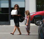 Halle Berry picking up a cake with daughter 