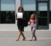 Halle Berry picking up a cake with daughter 