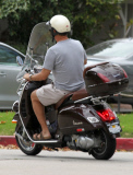 Exclusive... Tom Hanks Rides His Vespa Around Town 