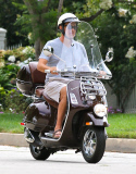 Exclusive... Tom Hanks Rides His Vespa Around Town 
