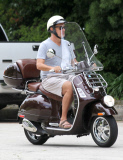Exclusive... Tom Hanks Rides His Vespa Around Town 