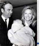 Carrying Baby Daughter Elisabeth Murdoch Mr Rupert Murdoch Chairman Of News Ltd The Australian Publishing Group Is Pictured Wit His Wife Anna On Their Arrival At Heathrow Airport Today. Mr Murdoch Was Reported To Have Flown Back To London With Comple