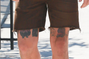 Shia LaBeouf displays his new 2Pac 'Thug Life' tattoo at the gym