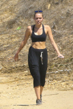 *EXCLUSIVE* Miley Cyrus multitasks on a hike in the hills with friends
