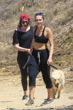 *EXCLUSIVE* Miley Cyrus multitasks on a hike in the hills with friends