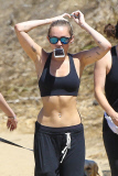 *EXCLUSIVE* Miley Cyrus multitasks on a hike in the hills with friends