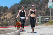 *EXCLUSIVE* Miley Cyrus multitasks on a hike in the hills with friends