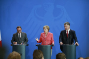 Minsker Abkommen: Merkel, Hollande und Poroschenko treffen sich in Berlin
