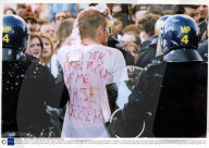 A Bloodied Protestor Is Led Away By Riot Police During 'never Mind The Ballots' Protest Against The Forthcoming General Election. Protestors Joined A March By Sacked Liverpool Dockers Starting At Kennington Park And Ending Up At Trafalgar Square Tr