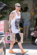 *EXCLUSIVE* Brian Austin Green wears his "Life Hurts" shirt while out shopping