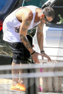 *EXCLUSIVE* Brian Austin Green wears his "Life Hurts" shirt while out shopping