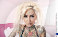 Portrait of stylish tattooed woman