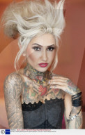 Portrait of stylish tattooed woman