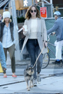 Dakota Johnson takes her dog Zeppelin for a walk in the West Village
