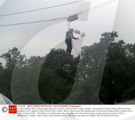 London's Mayor Boris Johnson gets stuck on a zip wire, Victoria Park, London, Britain - 06 Aug 2012
