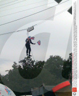 London's Mayor Boris Johnson gets stuck on a zip wire, Victoria Park, London, Britain - 06 Aug 2012