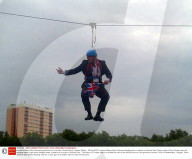 London's Mayor Boris Johnson gets stuck on a zip wire, Victoria Park, London, Britain - 06 Aug 2012