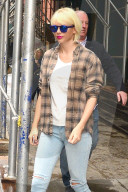 Taylor Swift wears bright white Keds on a rainy New York day