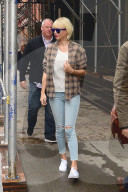 Taylor Swift wears bright white Keds on a rainy New York day