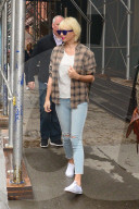 Taylor Swift wears bright white Keds on a rainy New York day