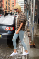 Taylor Swift wears bright white Keds on a rainy New York day