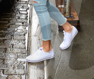 Taylor Swift wears bright white Keds on a rainy New York day