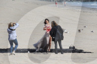 Alessandra Ambrosio does a photoshoot by the ocean
