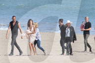 Alessandra Ambrosio does a photoshoot by the ocean