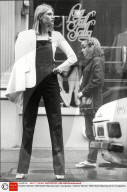 Fashion Women 1980 Model Wearing Denim Dungarees.