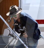 Johnny Depp Leaving Brisbane Airport With Injured Hand