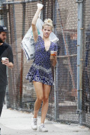 Hailey Clauson shows off her model legs in a short dress