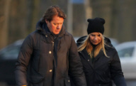LINDA DE MOL and partner take a walk with their dogs