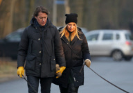 LINDA DE MOL and partner take a walk with their dogs