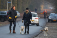 LINDA DE MOL and partner take a walk with their dogs