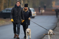 LINDA DE MOL and partner take a walk with their dogs