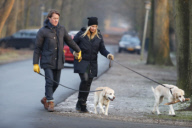 LINDA DE MOL and partner take a walk with their dogs