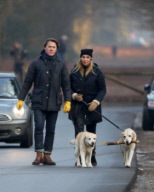 LINDA DE MOL and partner take a walk with their dogs
