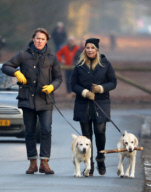 LINDA DE MOL and partner take a walk with their dogs