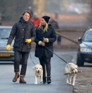 LINDA DE MOL and partner take a walk with their dogs