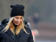 LINDA DE MOL and partner take a walk with their dogs