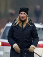 LINDA DE MOL and partner take a walk with their dogs